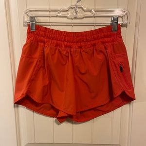 Lululemon Tracker 4in short. Size 6. Poppy colored